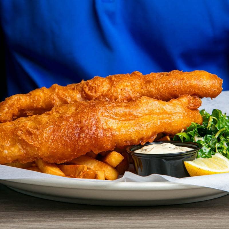 Battered fish and chips served with kaleslaw